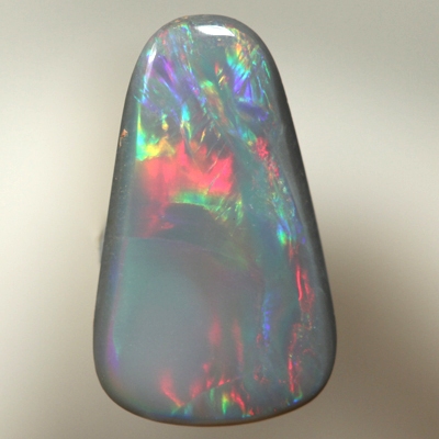 SOLID SEMI BLACK OPAL Rolling flashes of multicolours